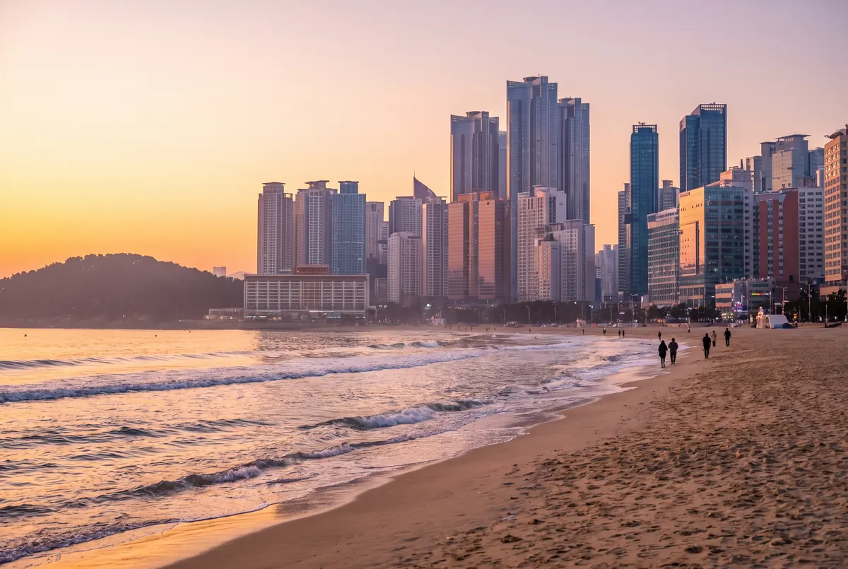 Haeundae Beach and the Busan skyline at sunset